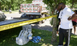 What’s left of a statue of Christopher Columbus lays party next to a city owned flatbed tr...