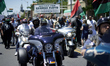 Community members take part in a Black Lives Matter protest, organized by Black Men Rising...