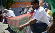 Demonstrators take a knee 8 minutes and 46 seconds during a Black Lives Matter protest mar...
