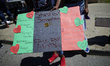 Community members take part in a Black Lives Matter protest, organized by Black Men Rising...