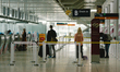 Passengers wait  and queue at a Eurowings check-in desk of Cologne Bonn airport, on June 1...
