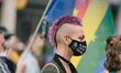 A woman with face mask 'Black lives matter'  is seen during the pride demo in Cologne, Ger...