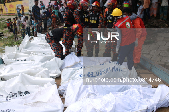 Rescuer workers recovered bodies of victims after a ferry capsized at Sadarghat Launch terminal in Dhaka, Bangladesh on June 29, 2020. At le...