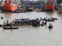 Rescuer workers conducting operation after a ferry capsized in Buriganga River at Sadarghat Launch terminal in Dhaka, Bangladesh on June 29,...
