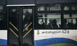 Syrian people after they got a seat in public transportation A group of people Wrestling t...
