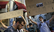 Protesters hold signs during a march in Sofia, Bulgaria for on July 11, 2020 in opposition...