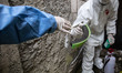 A Health worker give away her face shield after finishing the swab test process. Health Wo...
