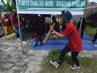 Residents simulate how to gather in a safe place in the event of an earthquake and tsunami in Wani Village, Donggala Regency, Central Sulawe...