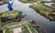 A view of public cemetery which submerged by flood waters from rising sea levels on July 1...