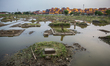 A view of public cemetery which submerged by flood waters from rising sea levels on July 1...
