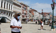 People relax at St. Marks's Square, Venice, Italy on June 17, 2020.  Tourists return in Ve...