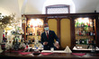 A waiter wearing a protective mask waits the custumers in Venice, Italy on June 17, 2020....