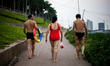 Nanning, China, the 25 August 2011. Swimmers in the YongJiang river crossing te city of Na...