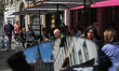 People have a rest under the tents of café in downtown Brussels, Belgium, July 23, 2020. 