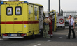A doctor helps his colleague to put on the Hazmat suit near airport in Brussels, Belgium,...