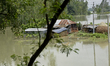 Villager's house seen surrounded by the flood water at Manikganj near Dhaka, Bangladesh, o...