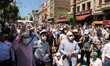 People wait for the first official Friday prayers to start outside Hagia Sophia Mosque on...