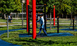 A park attendant from the Tree Library sanitizes the training equipment in Biblioteca degl...