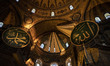 Curtains cover a Christian fresco inside the Hagia Sophia Grand Mosque after the first off...
