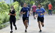 People runs in a park amid coronavirus emergency in Kolkata, India, 27 July, 2020.  