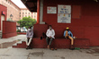 People with masks to curb the spread of covid-19 are seen waiting outside a closed metro s...