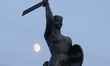 The Syrena monument, the symbol of the city is seen with the moon in the sky in Warsaw, Po...