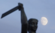 The Syrena monument, the symbol of the city is seen with the moon in the sky in Warsaw, Po...