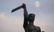 The Syrena monument, the symbol of the city is seen with the moon in the sky in Warsaw, Po...