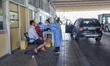 A man is tested by a female medical healthcare worker. Greece is checking arriving tourist...