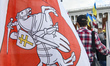 People with Historical Belarusian flags during rally to support Belarusian opposition and...