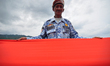 A state defense troop holding a 20 meter long red and white flag while commemorating the 7...