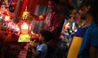 A Palestinian boy looks at a traditional Ramadan lantern in a street market in Gaza City,...