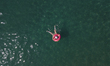 A drone view of tourists in Ascea Marina, a resort close to Cilento, Italy, on August 23,...