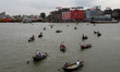 People are seen crossing the Buriganga river by boat in Dhaka, Bangladesh on August 25, 20...