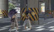 A Two Women weared mask with walk past to crosswalk at outskirt in Seoul, South Korea, on...