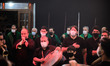 Iraqi immigration men living in Tehran wearing protective face masks hold swords as they t...