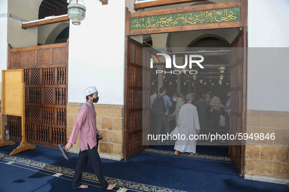 Muslim worshippers, mask-clad and distanced from each other due to the COVID-19 coronavirus pandemic, inside the historic al-Azhar mosque in...