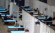 Patients admitted at a Covid care facility setup inside the Commonwealth Games Village Spo...