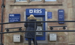 A person withdrawing cash from a Royal Bank of Scotland branch in Manchester on Tuesday 19...