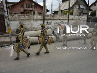 Indian forces march during restrictions on 10th day of Moharram in Srinagar, Indian Administered Kashmir on 28 August 2020. Authorities have...