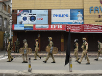 Indian forces march during restrictions on 10th day of Moharram in Srinagar, Indian Administered Kashmir on 28 August 2020. Authorities have...