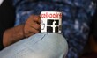 Facebook (social Networking Site) Logo is seen on a Cup as a man drinks tea in Baramulla,...