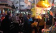 A Palestinian vendor sets up traditional Ramadan lanterns in a street market in Gaza City,...