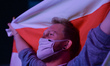 A protester holds white-red-white Belarusian flag.Members of the Belarusian diaspora from...