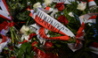 Candles, flowers, wreaths left during a day by people in front of Gdansk's Shipyard Gate n...