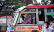 Passenger wearing face mask make their travels in a Bus during the coronavirus pandemic in...