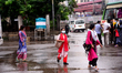 Passenger wearing face mask waits at a Bus Stop for make their travels during the coronavi...