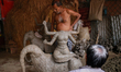 An artist works on a clay idol of the Hindu Goddess ahead of Durga Puja festival in Dhaka,...