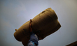 A labor carries goods as he loads on a boat in Dhaka, Bangladesh on September 1, 2020.  
