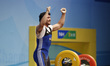 Yusupov Sherzodjon of Uzbekistan competes reaction in the Men's 85kg Group B weightlifting...